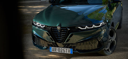 Alfa Romeo Tonale in Misano Blue Side Close Up with Person in Foreground ​